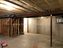 Empty basement in Lee's Summit Missouri before framing up walls with 2 x 4 wood studs